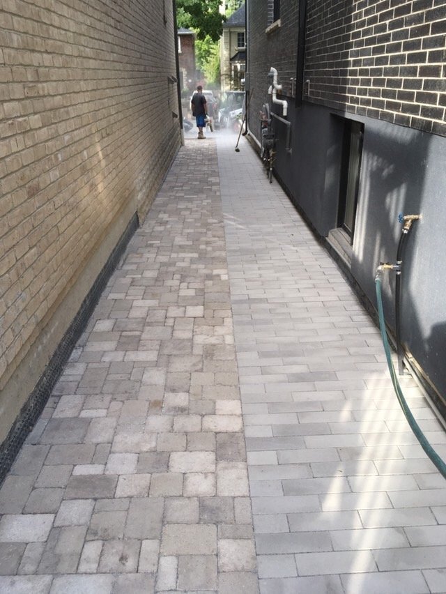 Stone paver side walkway between houses